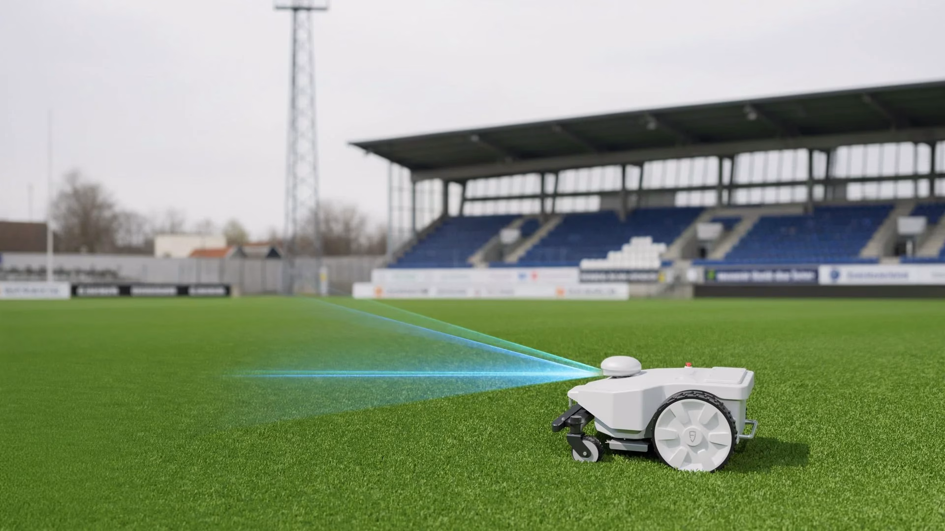 FJ Dynamics FRX robotic mower on football pitch